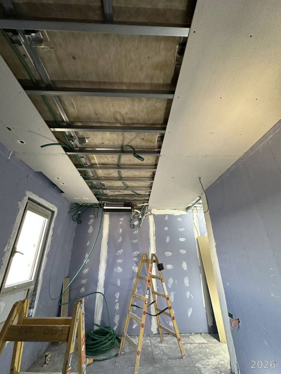 Drywall up and the room taking shape