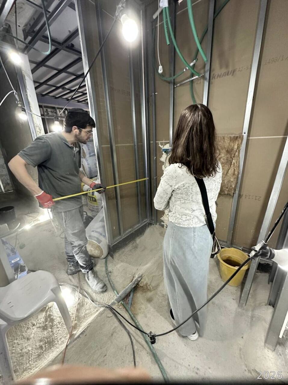 Measuring and marking the wall before electrical rough-in