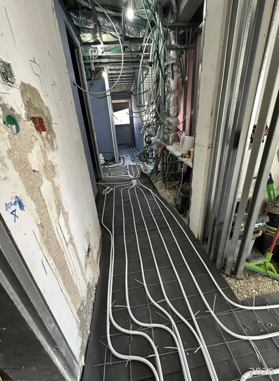 Floor heating loops running down a hallway