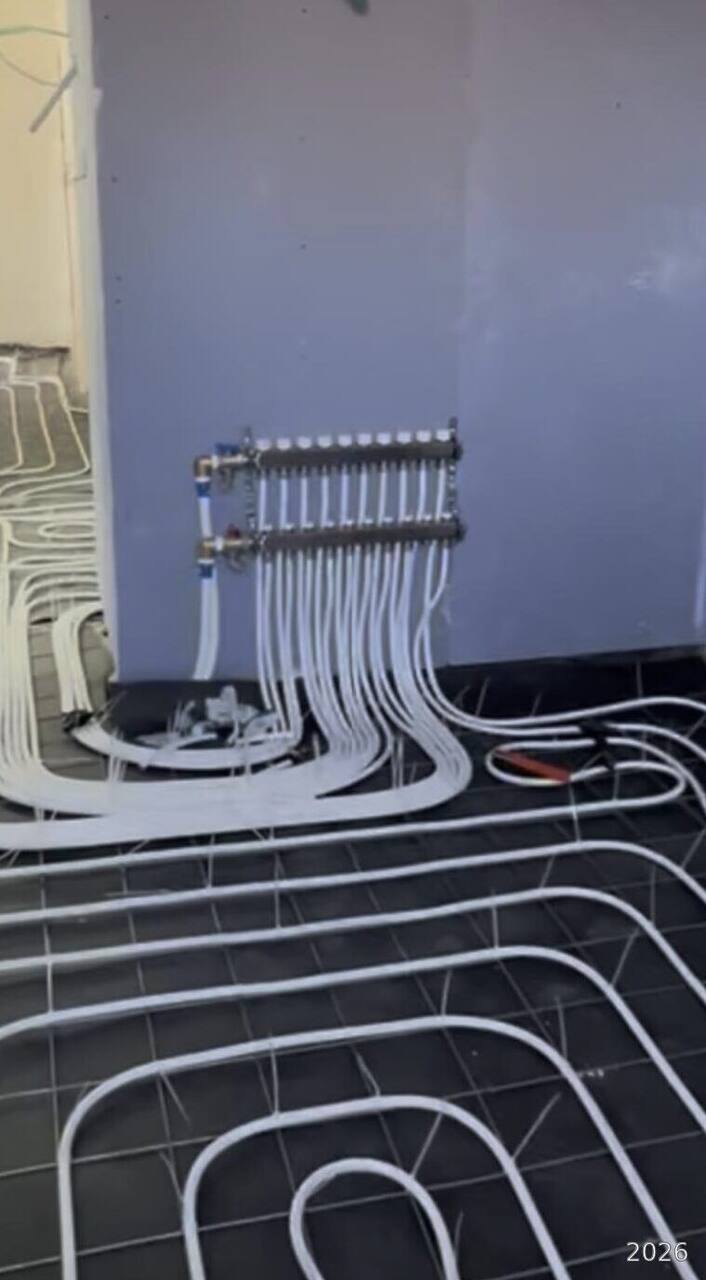 Floor heating manifold installed on the wall