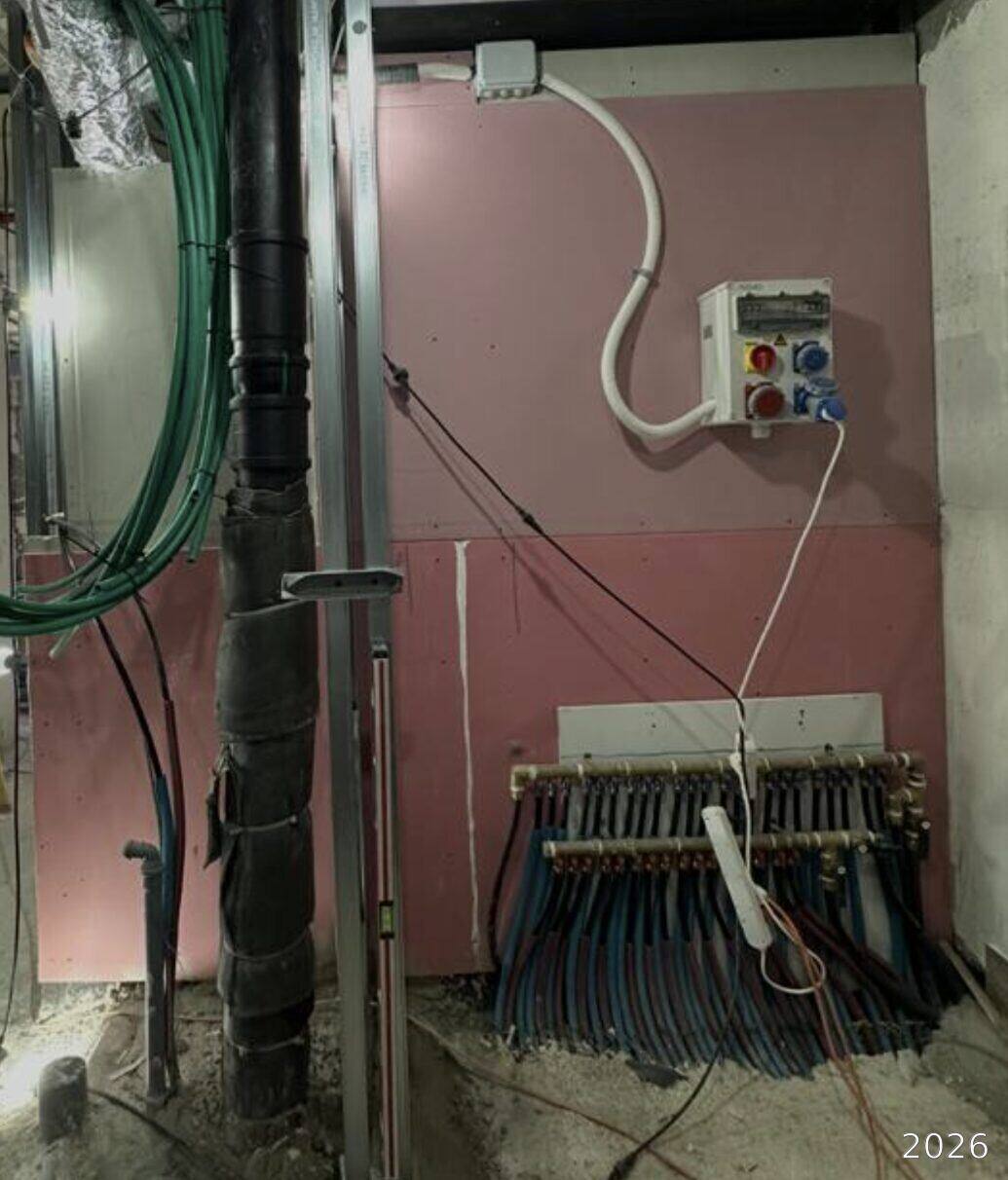 Plumbing manifold and electric panel installed