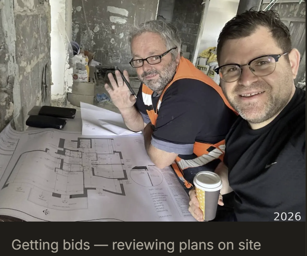 Reviewing renovation plans and getting bids on site
