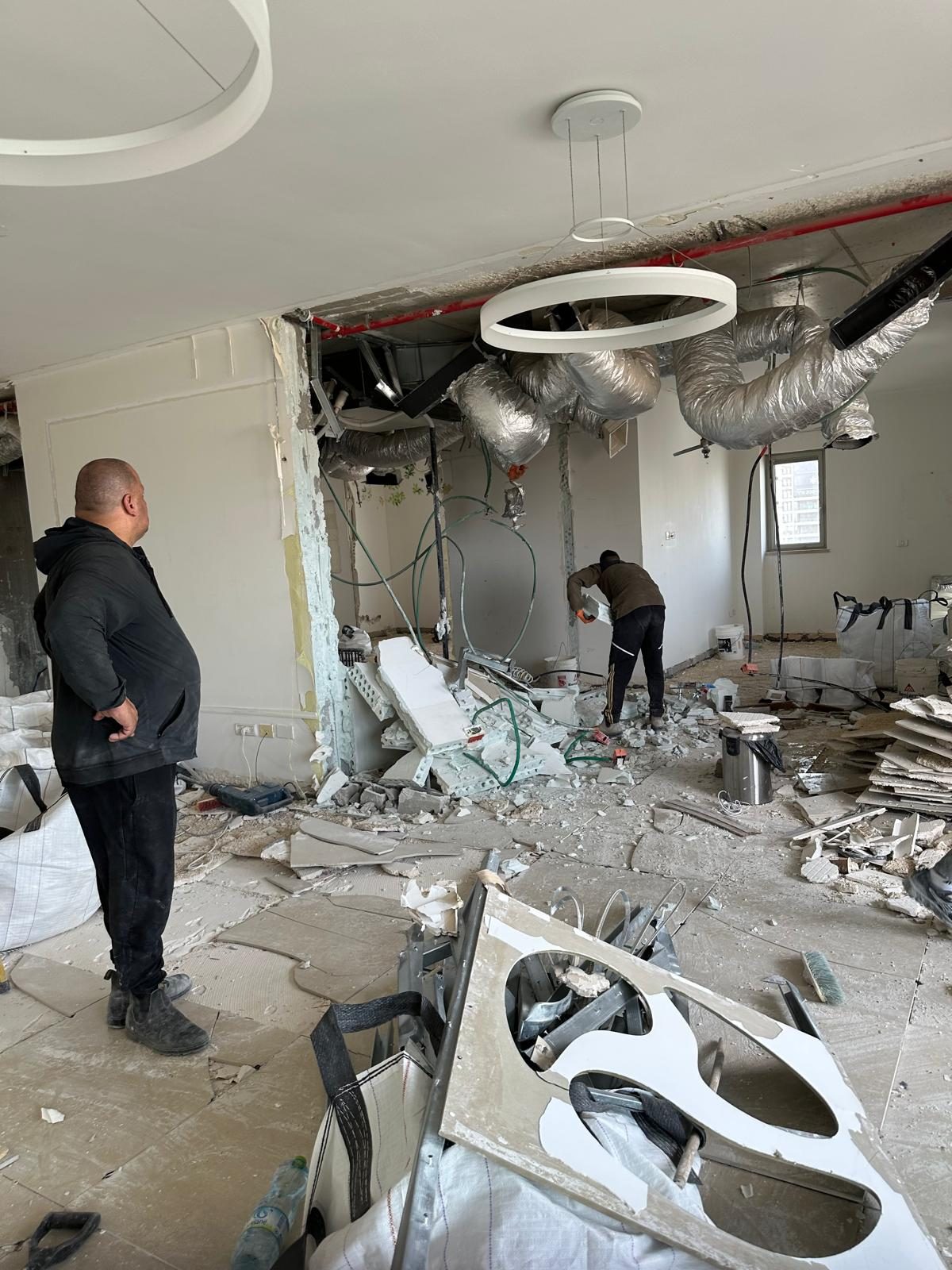 Demolition underway, walls and ceiling opened for MEP work